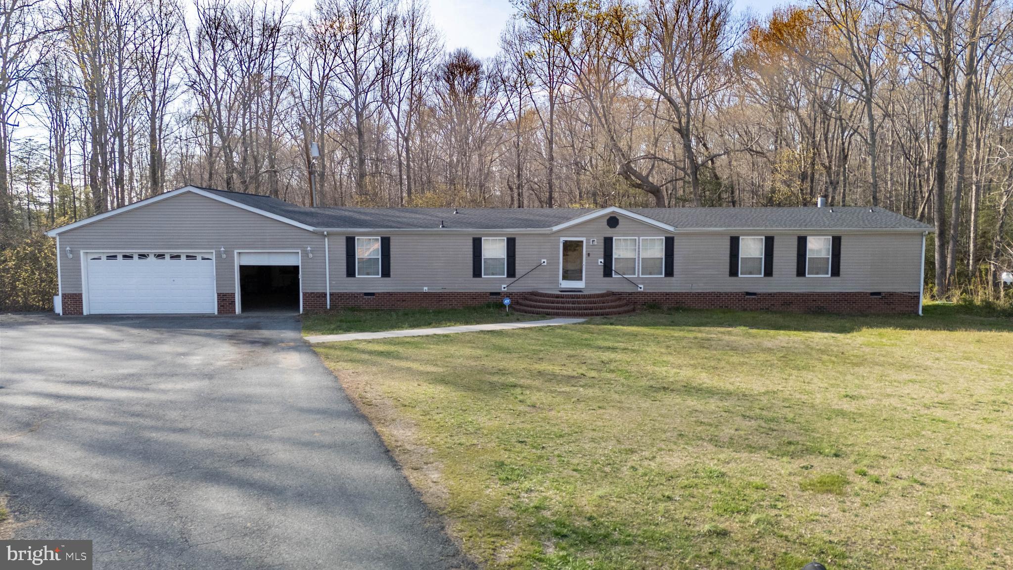 8791 Menokin Road Montross, VA 22520 - Photo 3 of 37 front view of a house with a yard