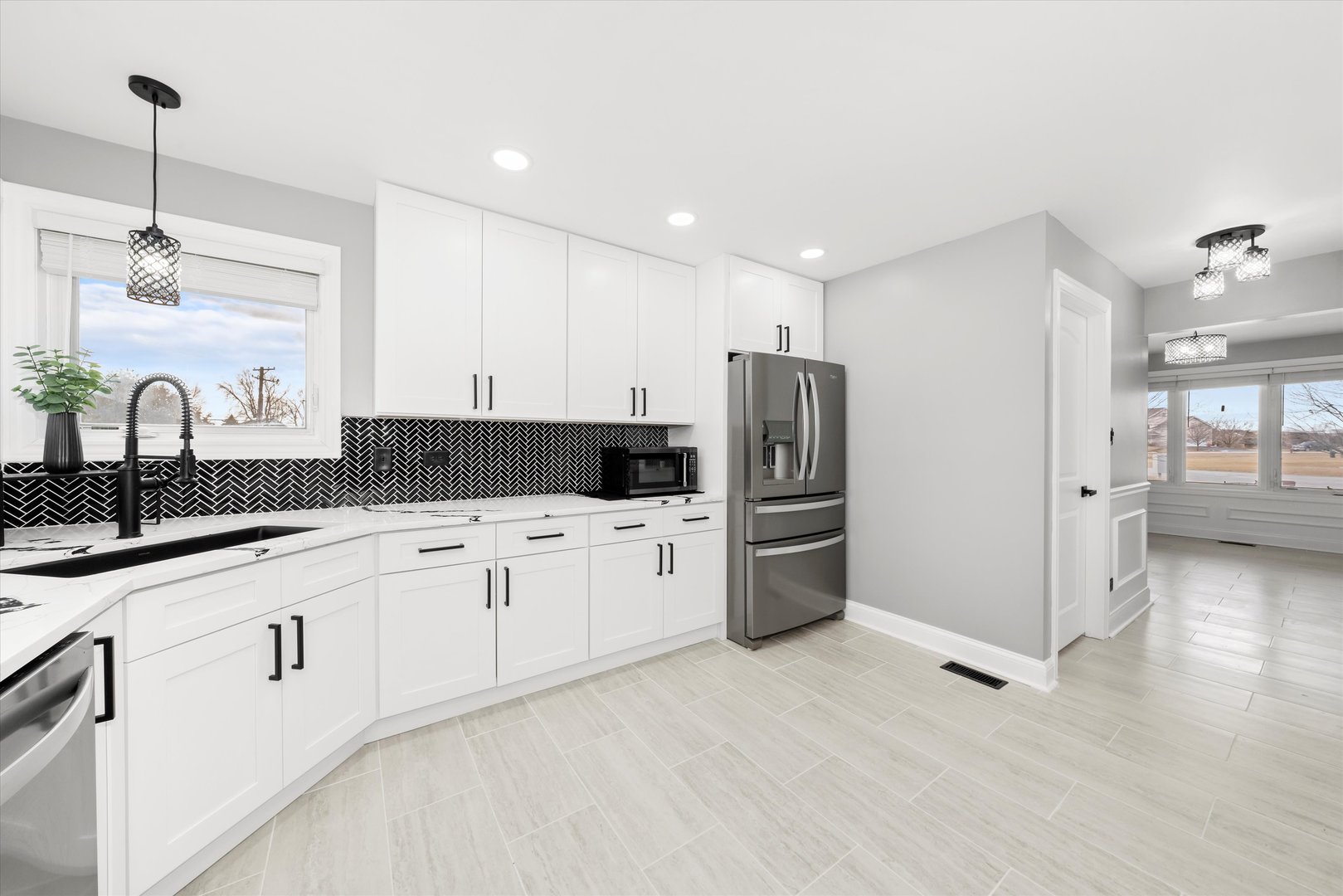 110 Sky View Lane Beecher, IL 60401 - Photo 12 of 53 a kitchen with stainless steel appliances granite countertop a refrigerator and a sink