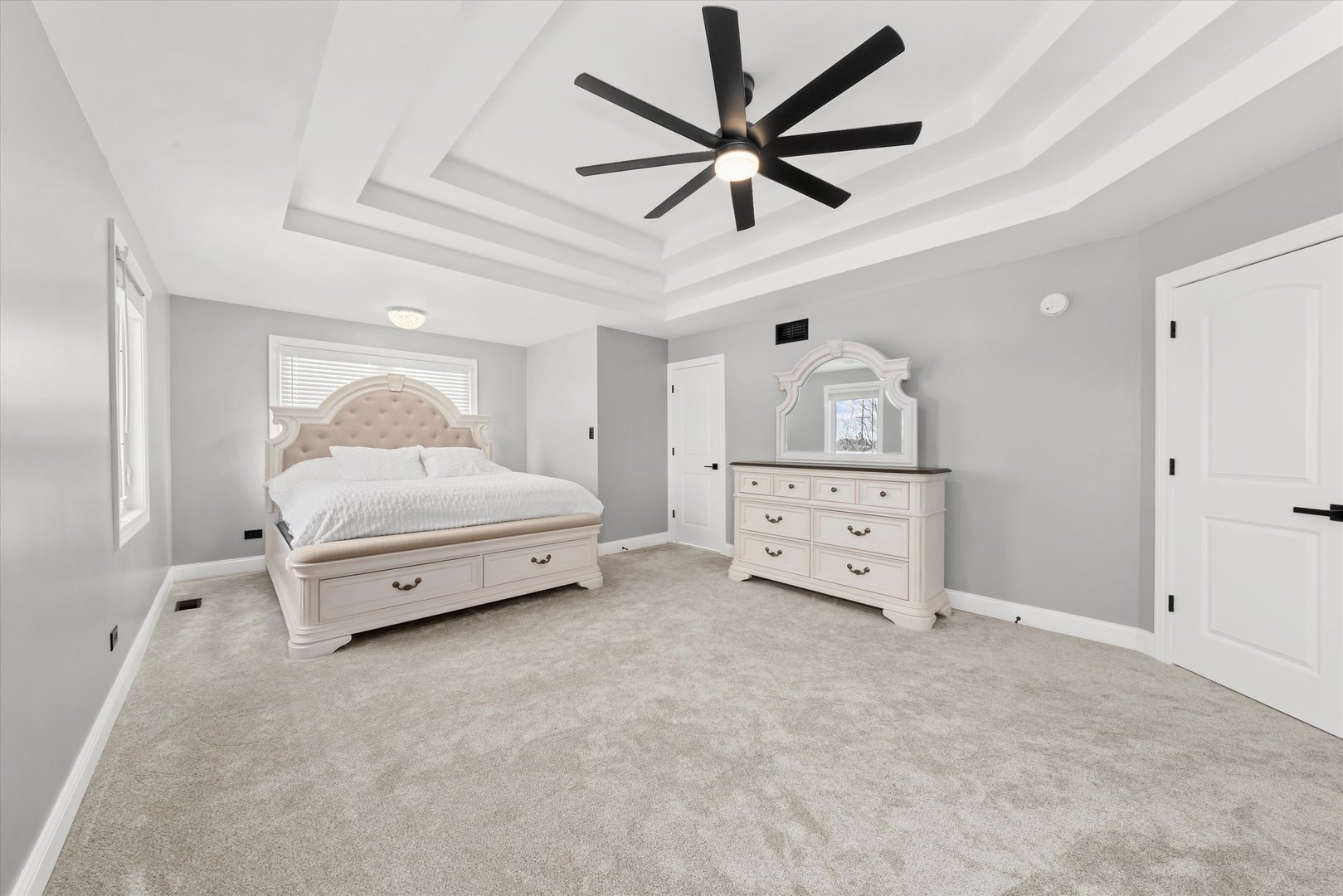 110 Sky View Lane Beecher, IL 60401 - Photo 23 of 53 a spacious bedroom with a bed and a chandelier