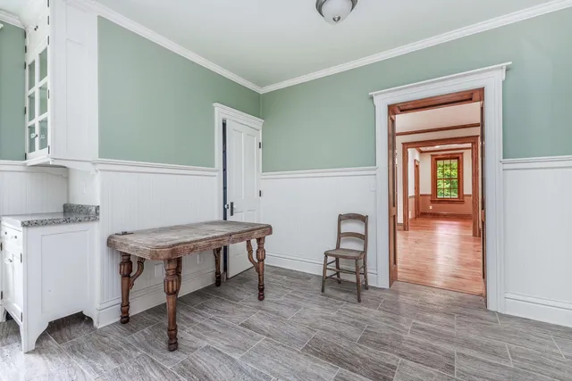 a room with furniture and wooden floor