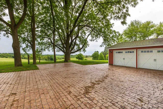 a view of a house with a yard and tree