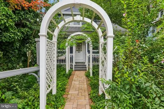 a close view of statue with a garden