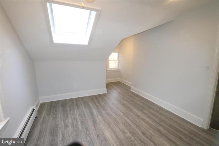 1637 Pennington Road Ewing, NJ 08618 - Photo 19 of 56 an empty room with wooden floor and windows