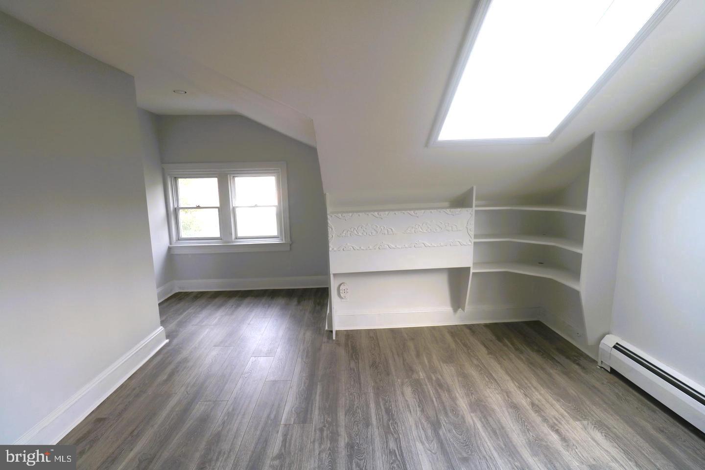 1637 Pennington Road Ewing, NJ 08618 - Photo 21 of 56 an empty room with wooden floor and windows