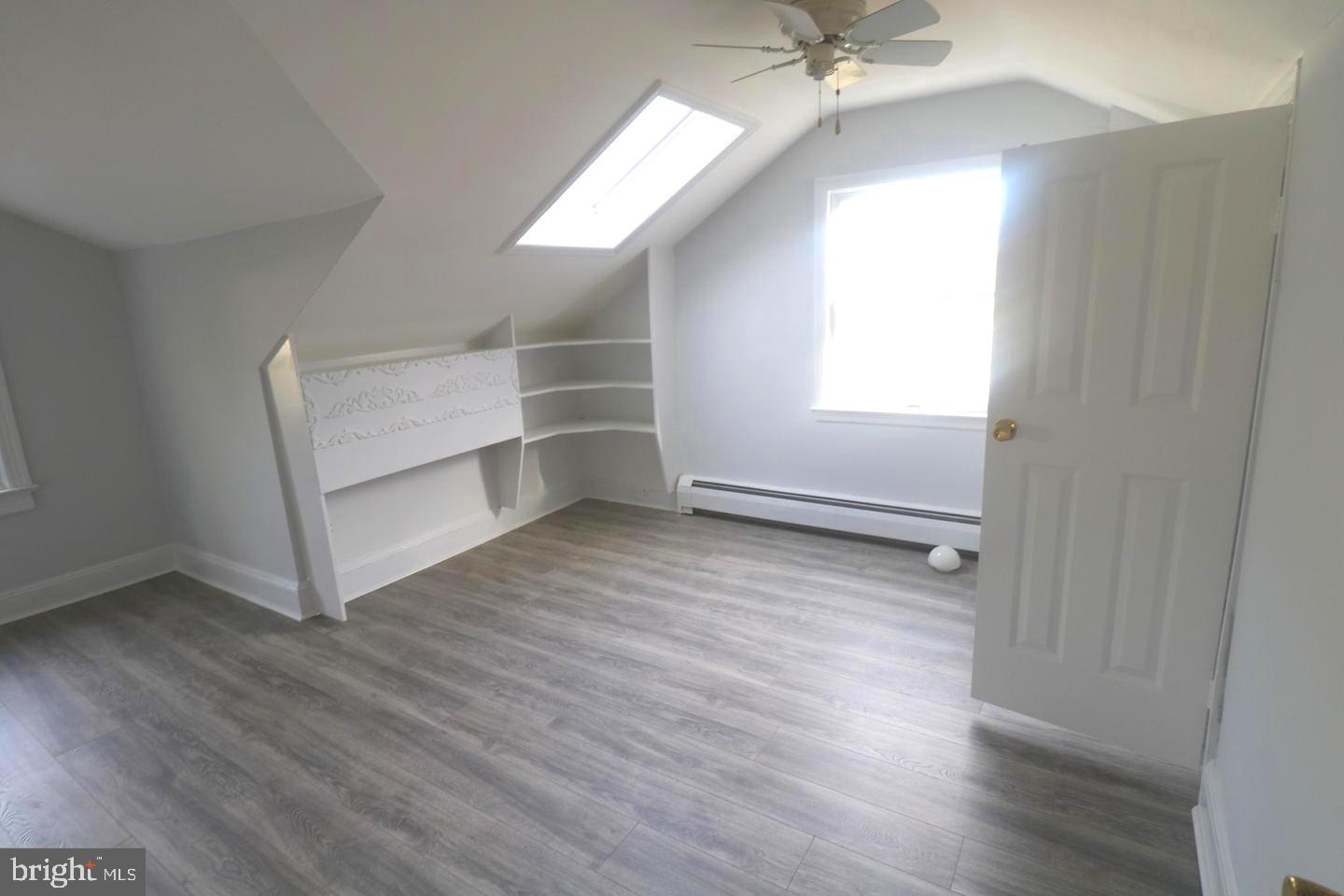1637 Pennington Road Ewing, NJ 08618 - Photo 23 of 56 wooden floor in an empty room with a window