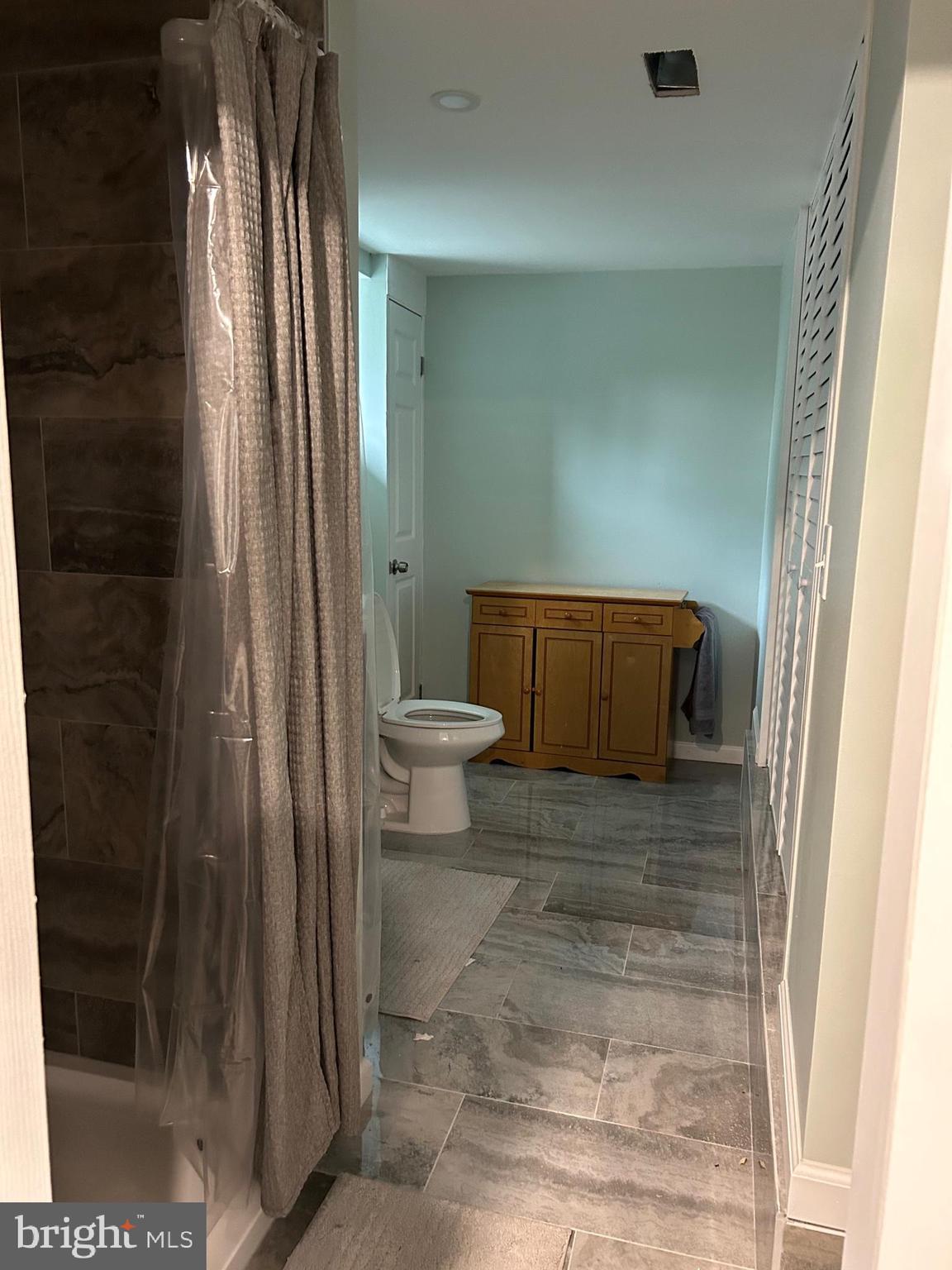 1637 Pennington Road Ewing, NJ 08618 - Photo 26 of 56 a bathroom with a toilet and a shower
