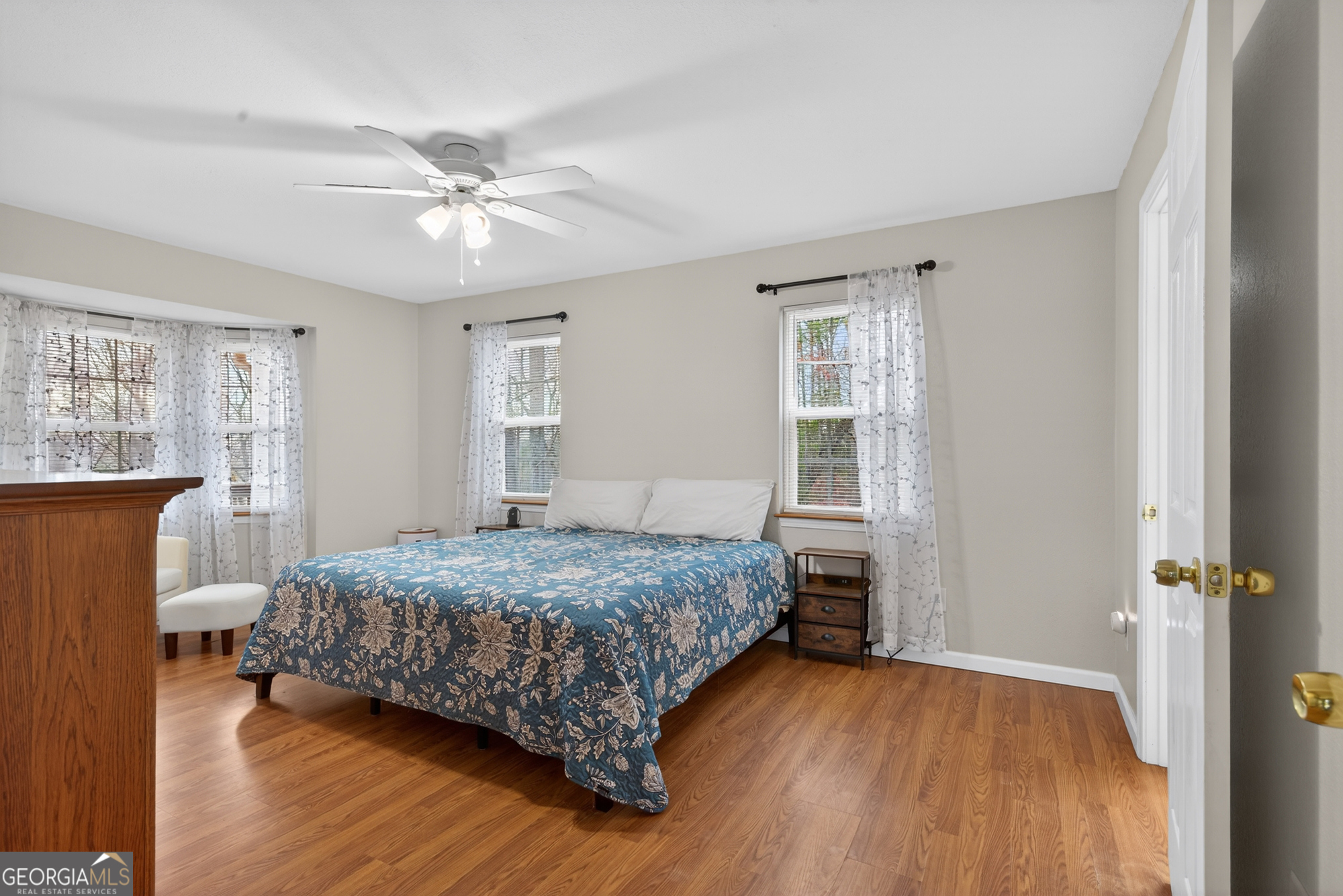 756 Gordon Thomas Road Blairsville, GA 30512 - Photo 15 of 65 a bedroom with a bed and wooden floor