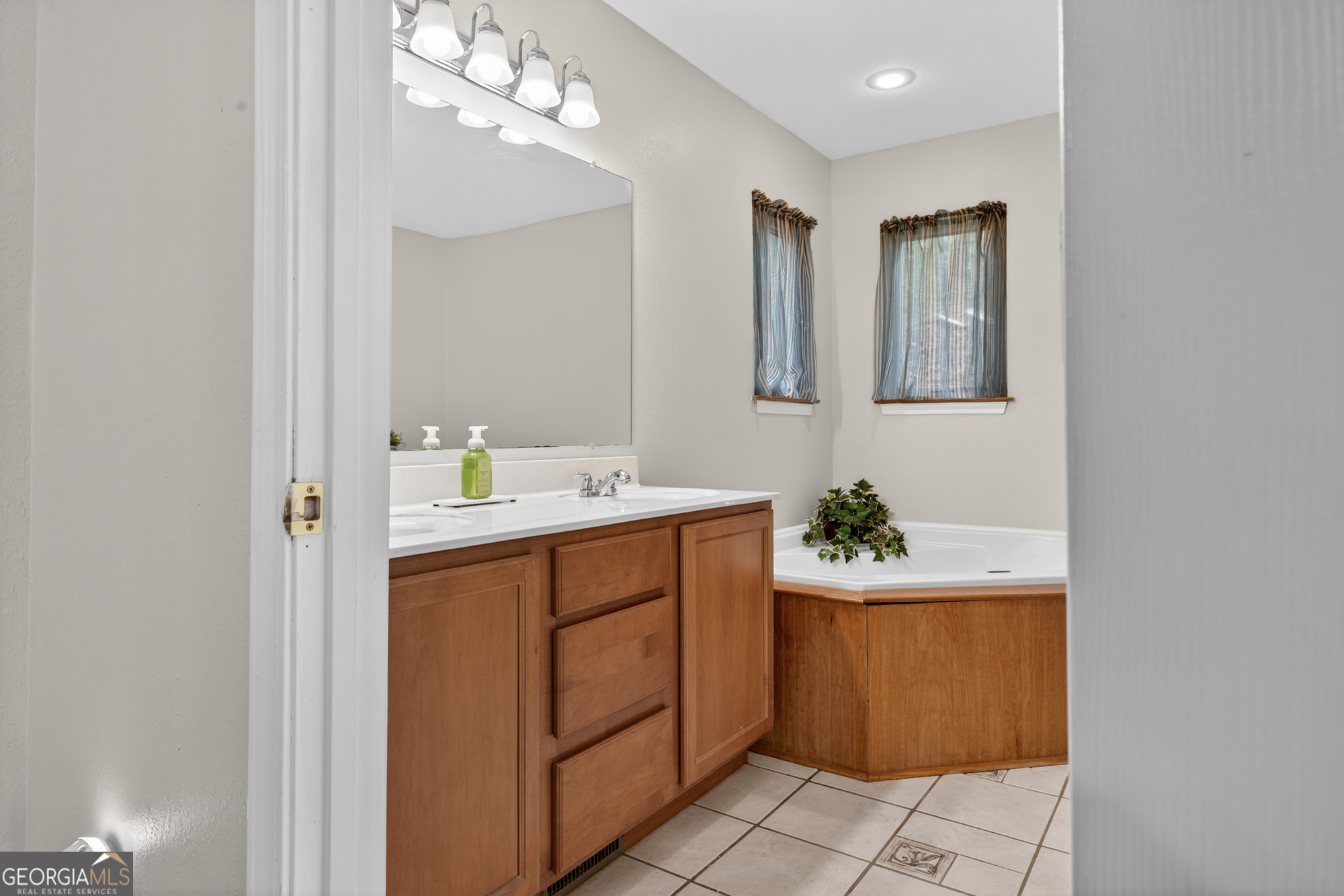 756 Gordon Thomas Road Blairsville, GA 30512 - Photo 18 of 65 a bathroom with a sink a vanity and a mirror