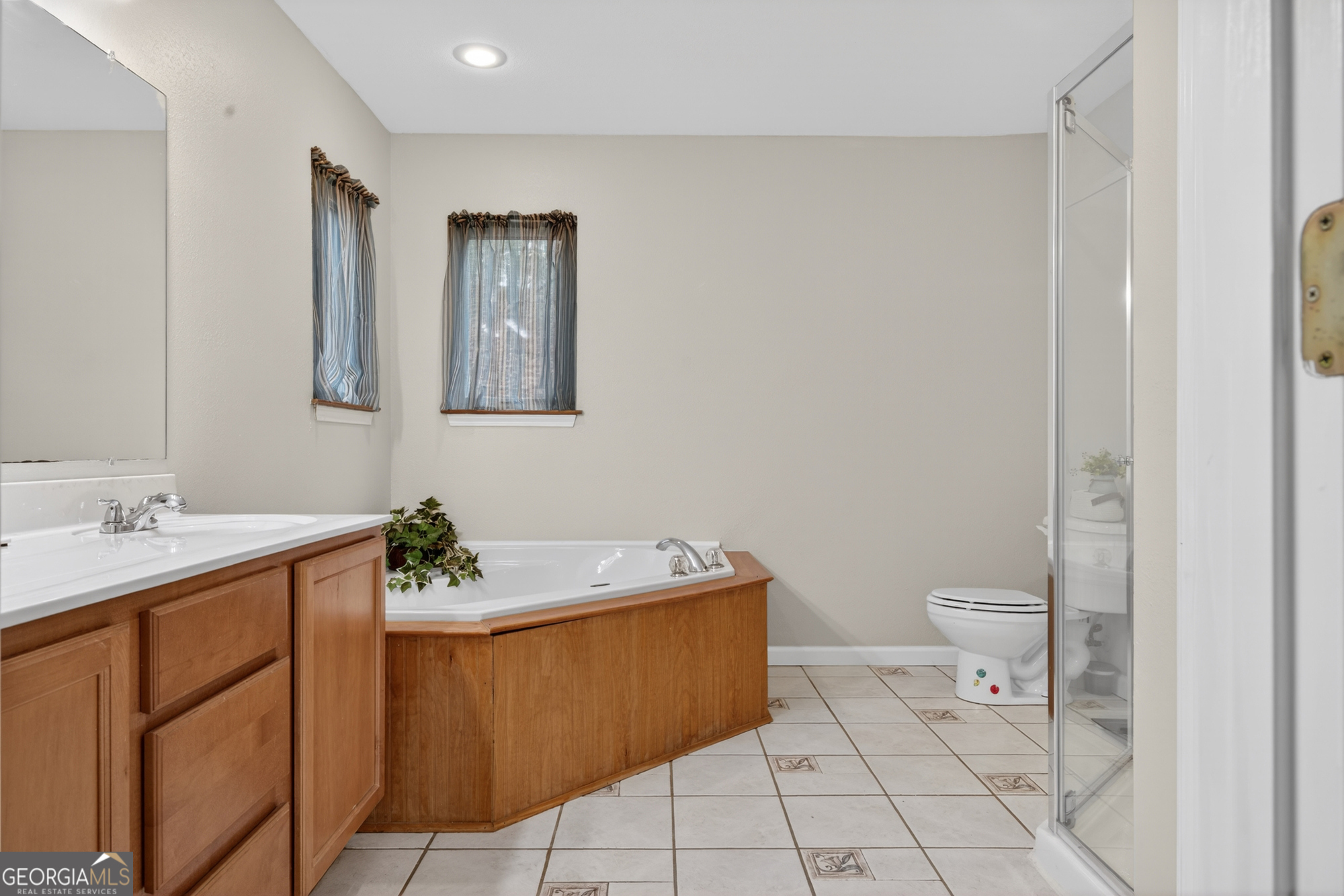 756 Gordon Thomas Road Blairsville, GA 30512 - Photo 19 of 65 a bathroom with a sink toilet and mirror