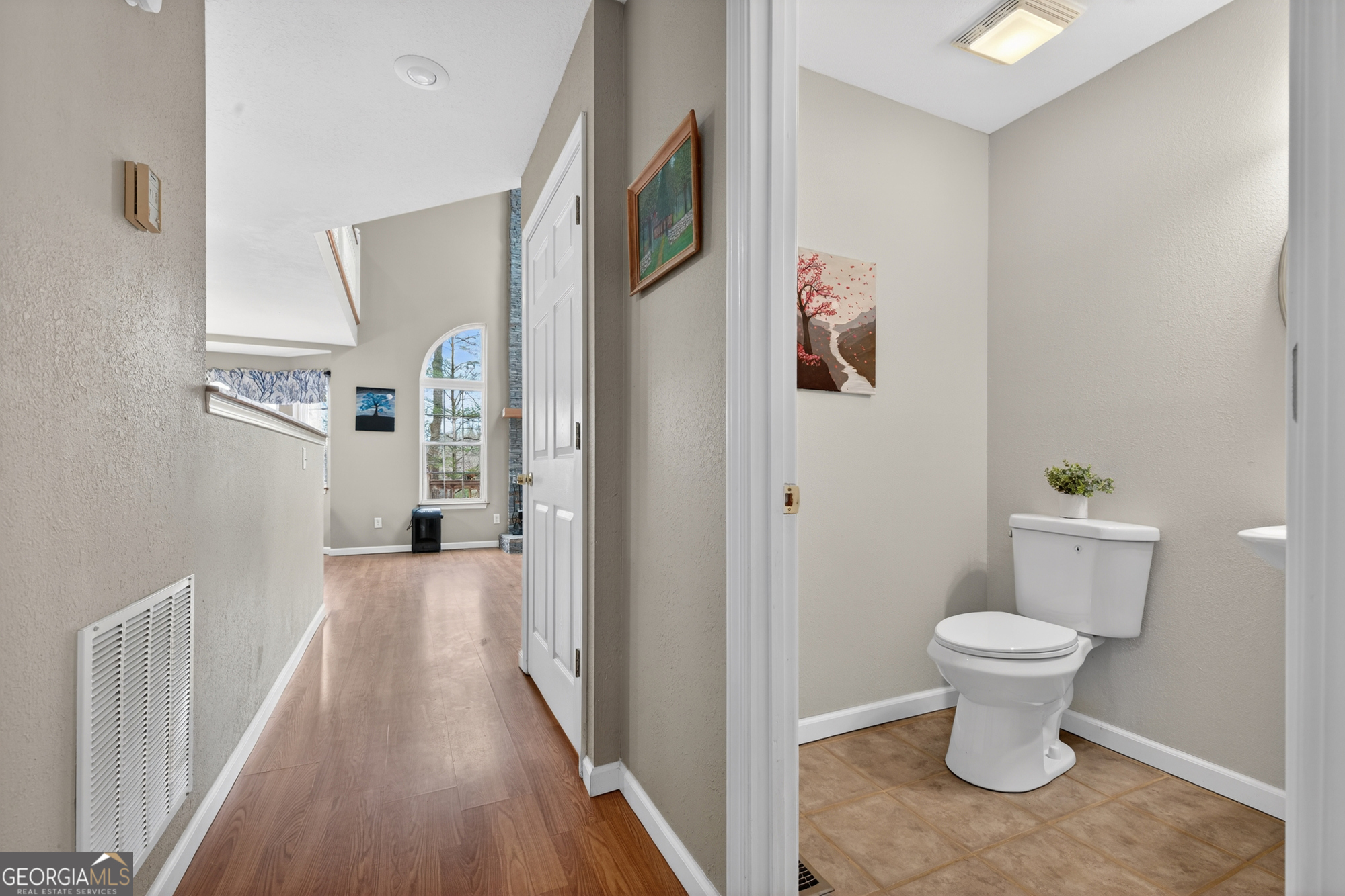756 Gordon Thomas Road Blairsville, GA 30512 - Photo 22 of 65 a view of a hallway with wooden floor and a toilet