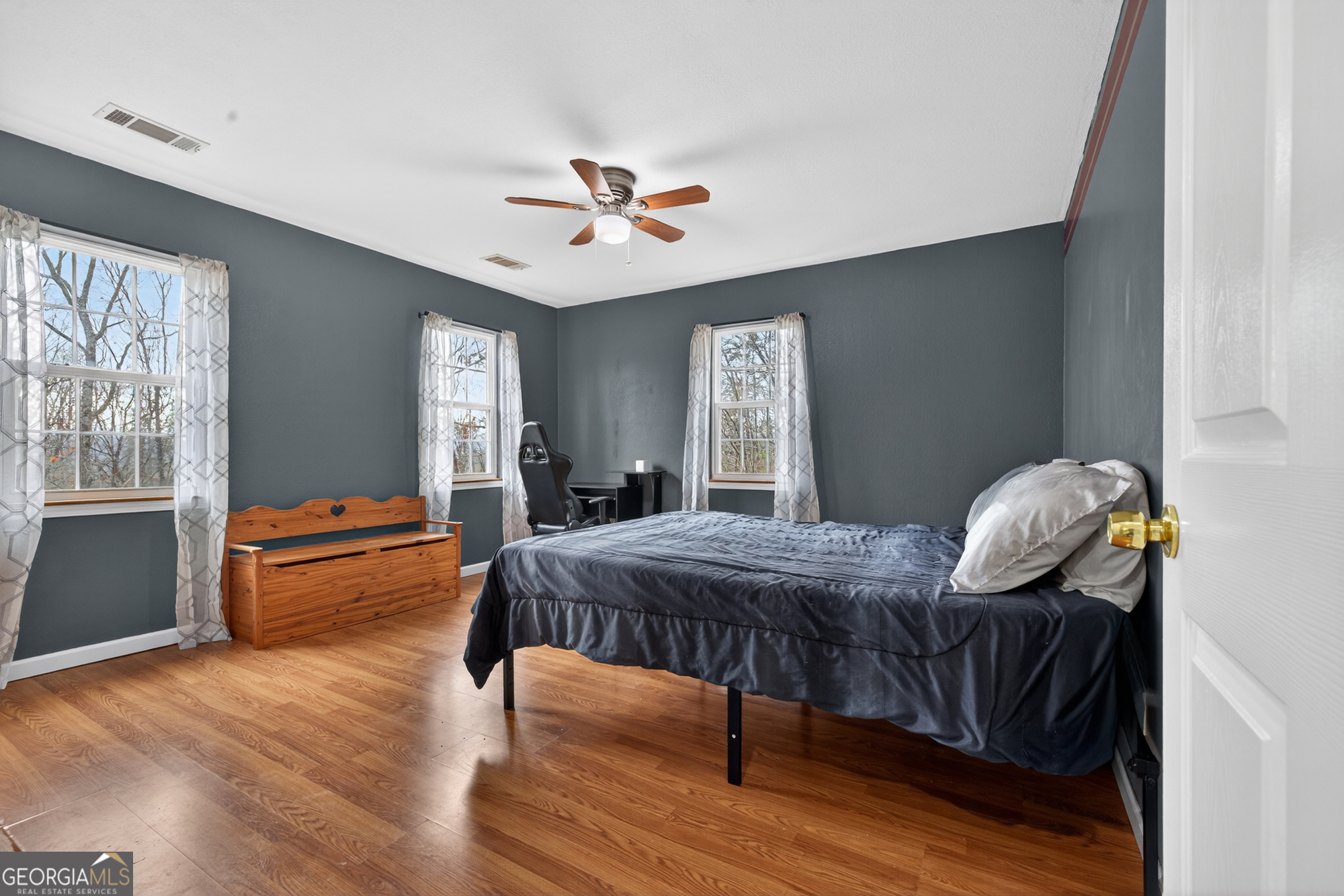 756 Gordon Thomas Road Blairsville, GA 30512 - Photo 28 of 65 a bedroom with furniture and wooden floor