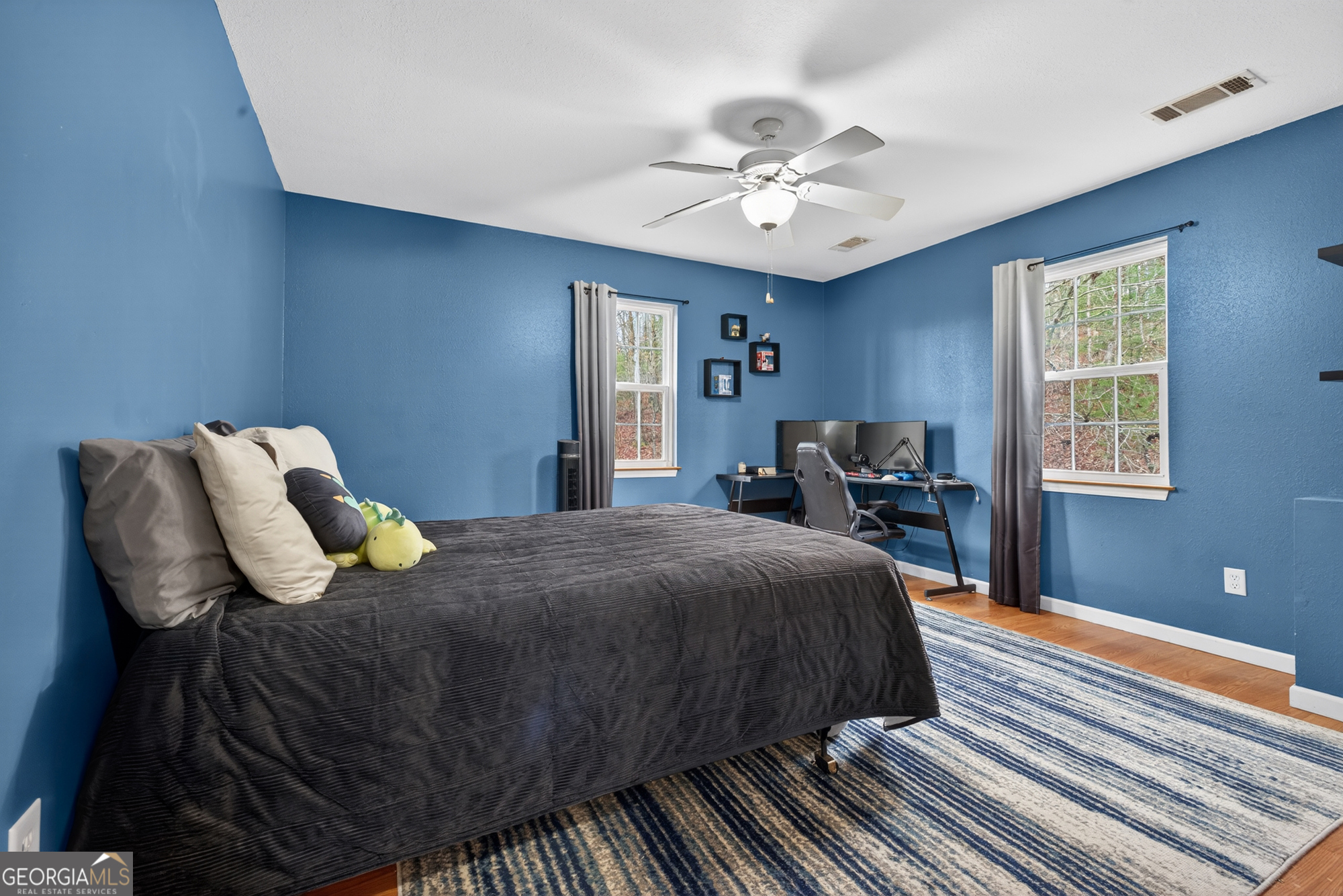 756 Gordon Thomas Road Blairsville, GA 30512 - Photo 30 of 65 a bedroom with a bed and window