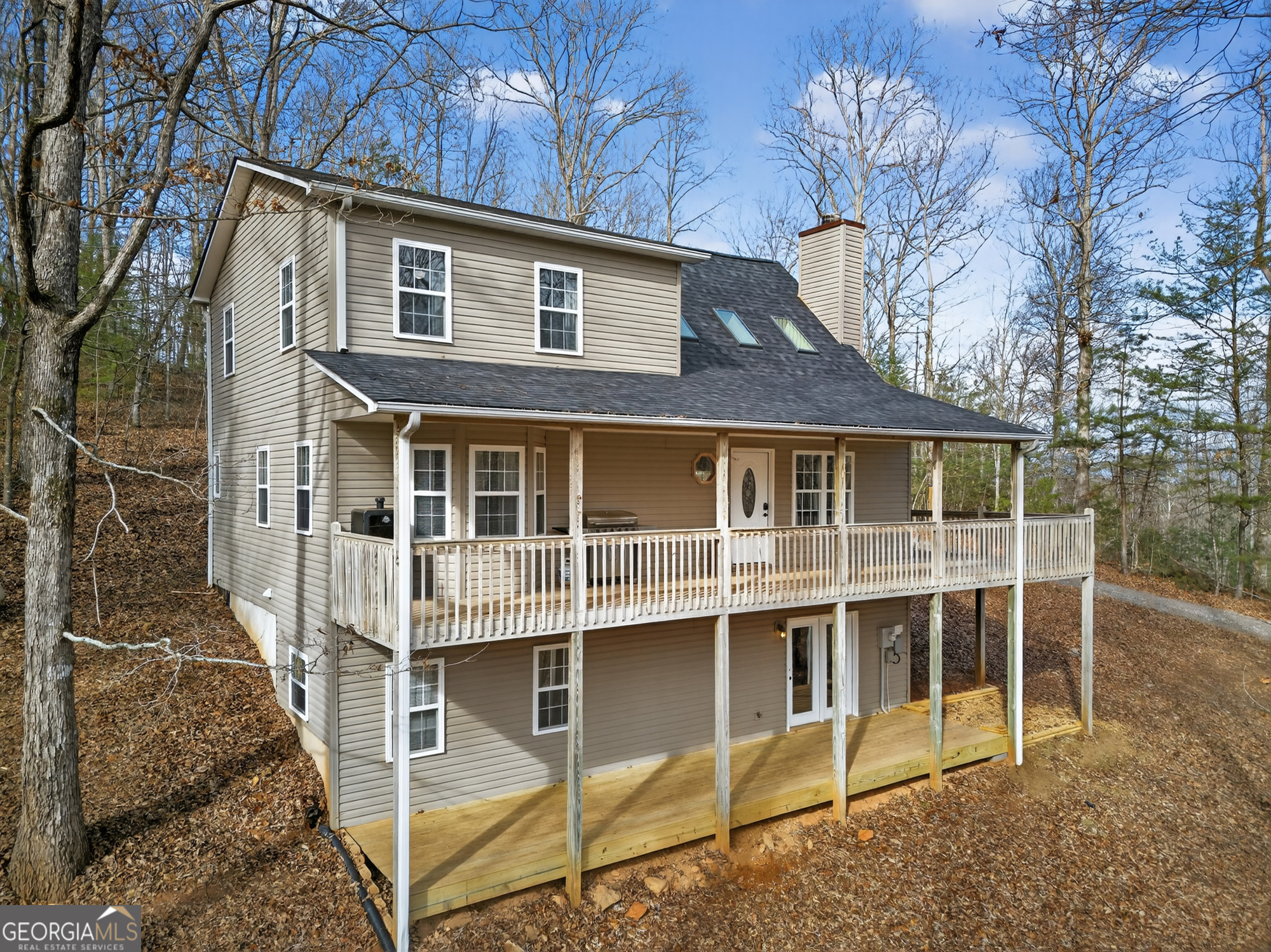 756 Gordon Thomas Road Blairsville, GA 30512 - Photo 3 of 65 a front view of a house with a yard and balcony