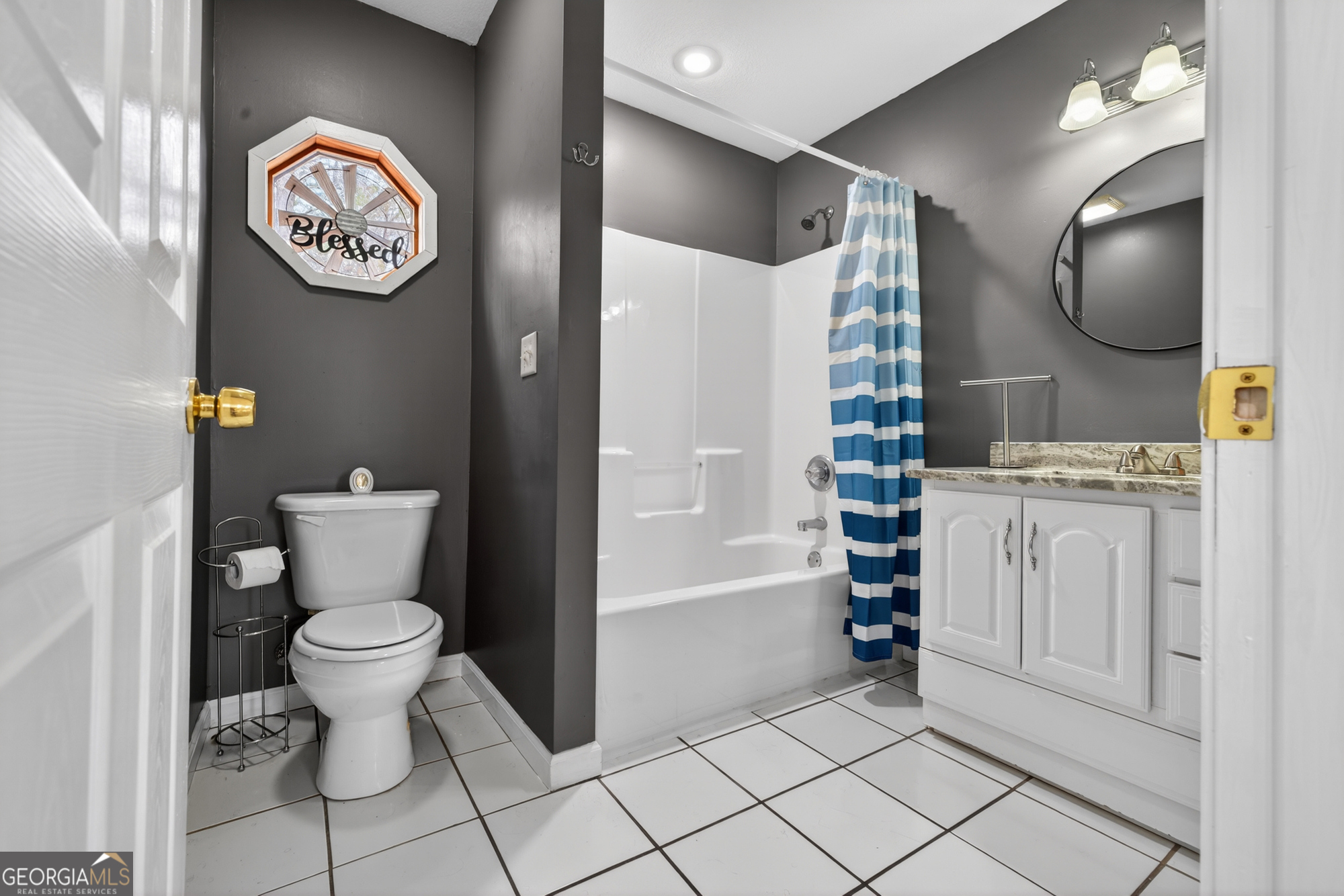 756 Gordon Thomas Road Blairsville, GA 30512 - Photo 32 of 65 a bathroom with a toilet sink and mirror