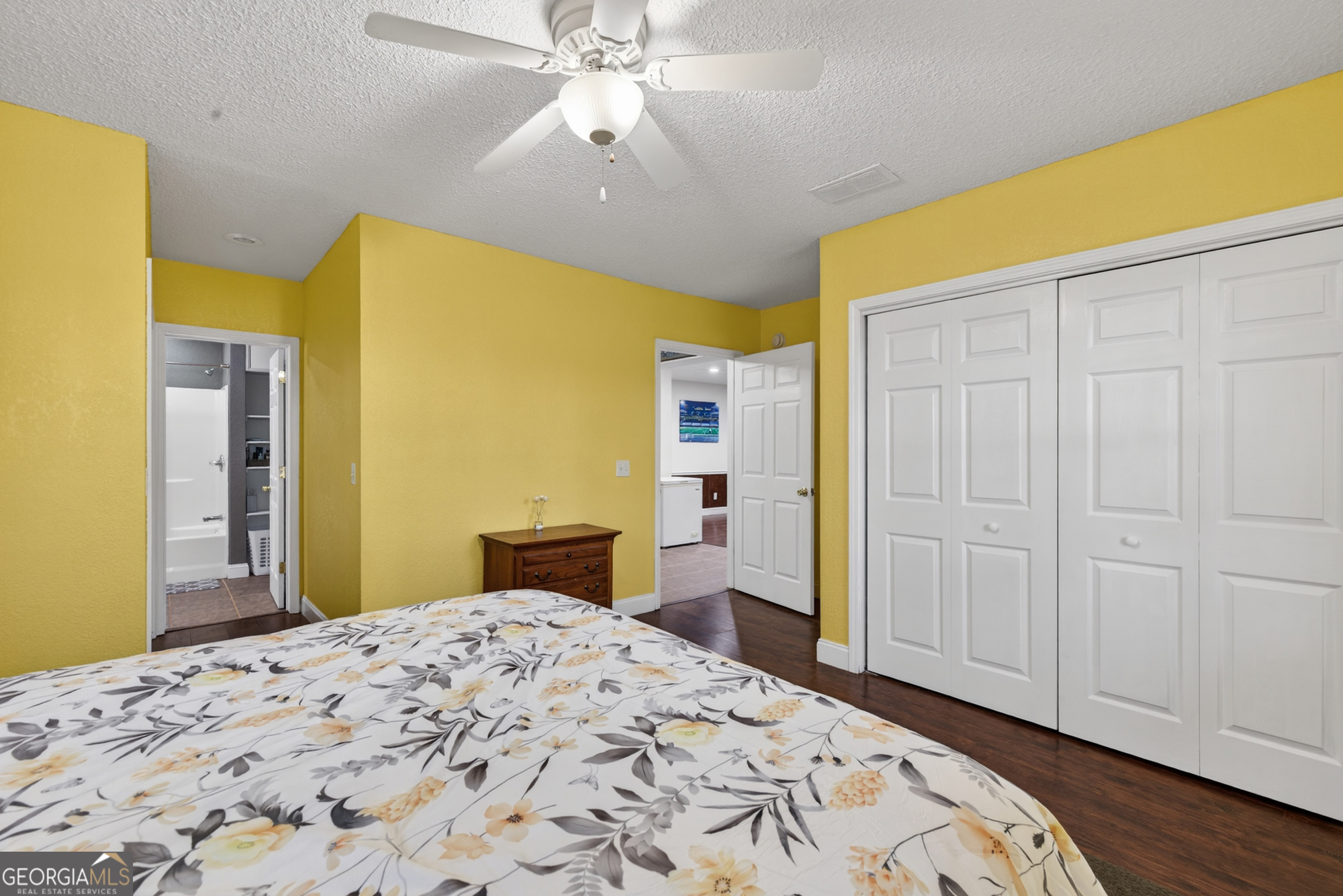 756 Gordon Thomas Road Blairsville, GA 30512 - Photo 40 of 65 a bedroom with a bed and wooden floor