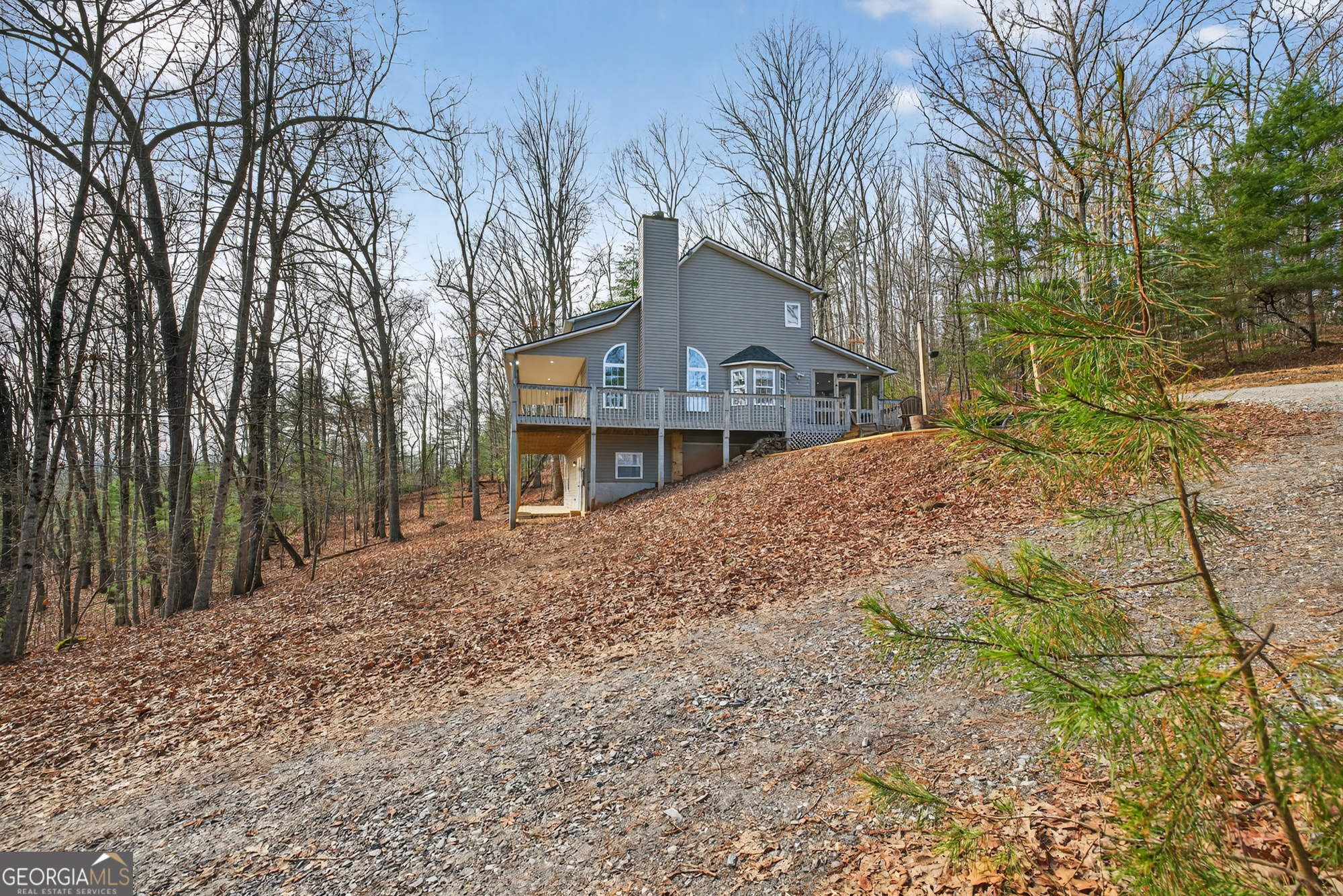 756 Gordon Thomas Road Blairsville, GA 30512 - Photo 47 of 65 a front view of a house with a yard and garage