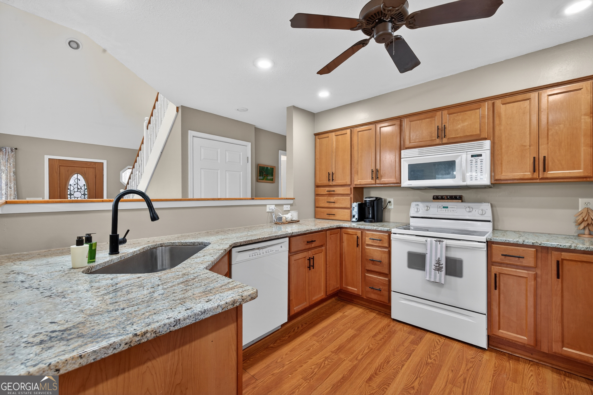 756 Gordon Thomas Road Blairsville, GA 30512 - Photo 8 of 65 a kitchen with stainless steel appliances granite countertop a sink stove and microwave