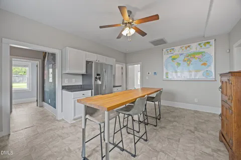 a close view of a sink and table in a kitchen