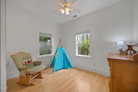 a spacious bedroom with a bed and a window