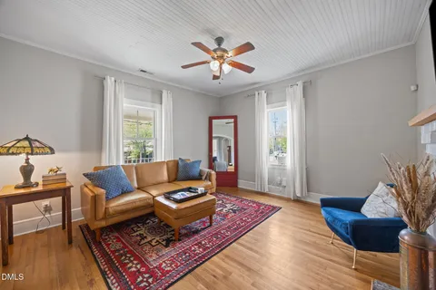 a kitchen with kitchen island a refrigerator stove microwave and cabinets