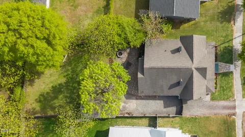 a view of a patio with table and chairs and potted plants
