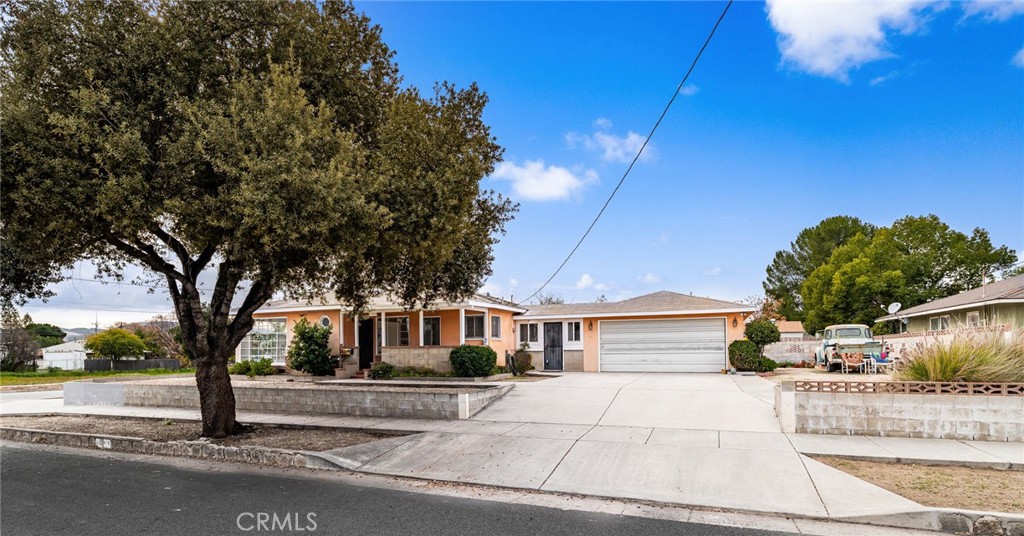 1203 Ohio Street Redlands, CA 92374 - Photo 2 of 27 a front view of a house with a yard