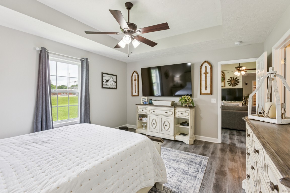 4510 Long Creek Road Lafayette, TN 37083 - Photo 13 of 25 a bedroom with a bed a flat screen tv and dresser