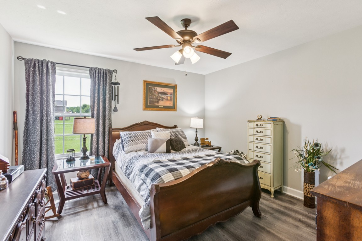 4510 Long Creek Road Lafayette, TN 37083 - Photo 17 of 25 a bedroom with a bed and a chandelier