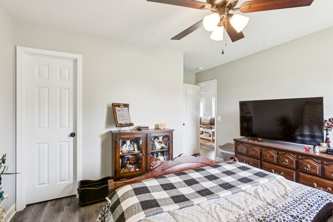 4510 Long Creek Road Lafayette, TN 37083 - Photo 18 of 25 a bedroom with a bed and a flat tv screen on wall