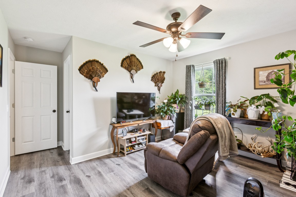 4510 Long Creek Road Lafayette, TN 37083 - Photo 21 of 25 a living room with furniture a flat screen tv and a large window