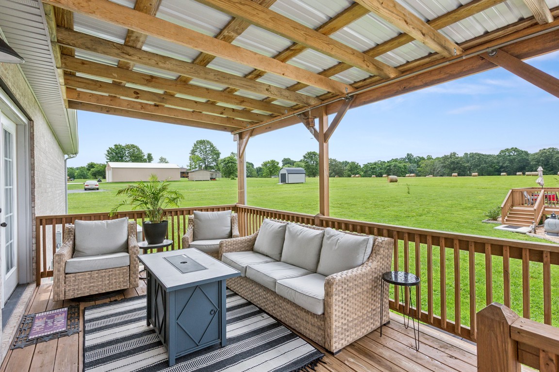 4510 Long Creek Road Lafayette, TN 37083 - Photo 22 of 25 a roof deck with couches and ocean view