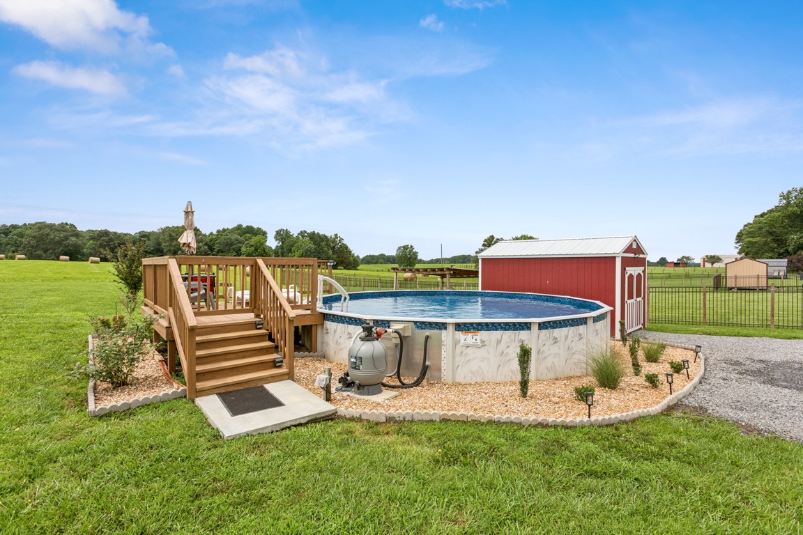 4510 Long Creek Road Lafayette, TN 37083 - Photo 23 of 25 a view of a swimming pool with a yard