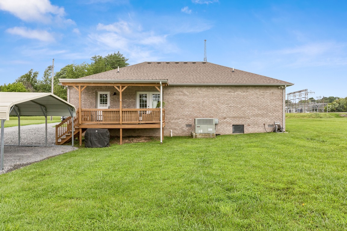 4510 Long Creek Road Lafayette, TN 37083 - Photo 24 of 25 a backyard of a house with table and chairs