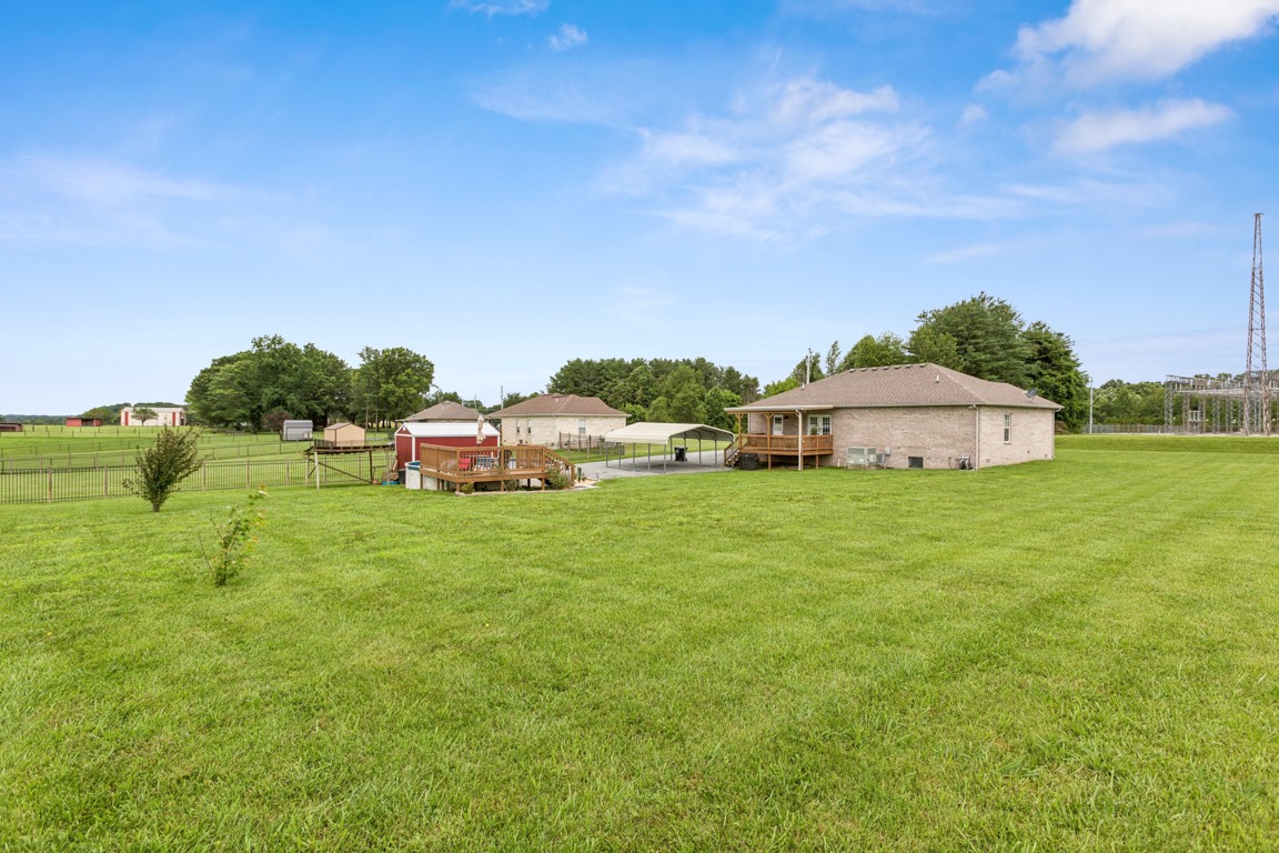 4510 Long Creek Road Lafayette, TN 37083 - Photo 25 of 25 a aerial view of a house with backyard garden and trees