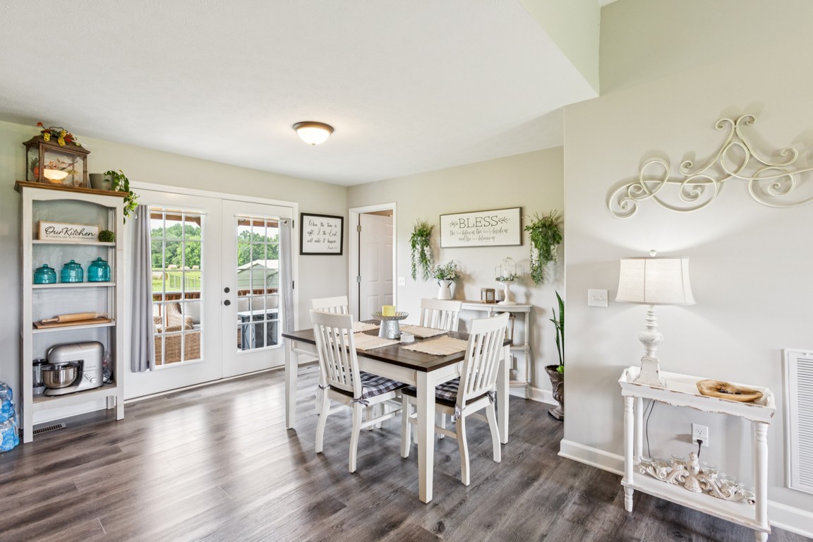 4510 Long Creek Road Lafayette, TN 37083 - Photo 8 of 25 a view of a dining room with furniture and wooden floor