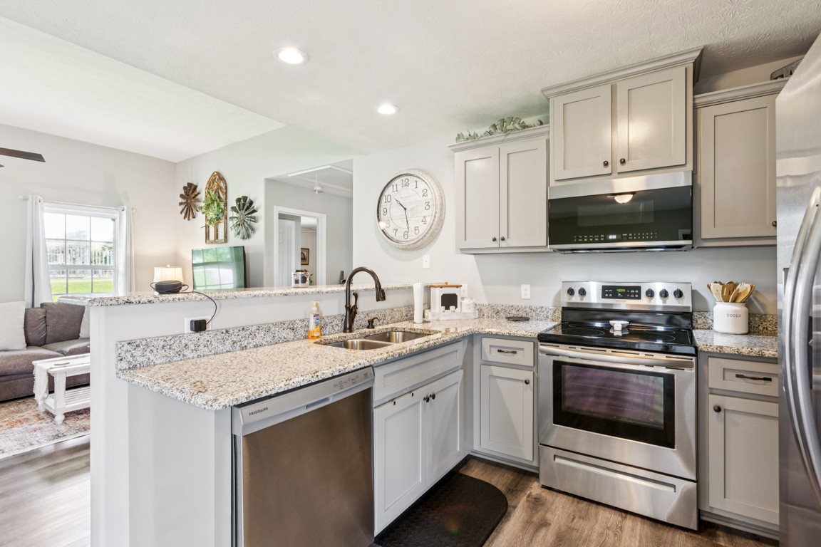 4510 Long Creek Road Lafayette, TN 37083 - Photo 10 of 25 a kitchen with a sink stove and microwave