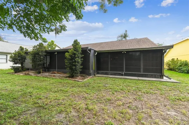 a living room with furniture a chandelier and a table