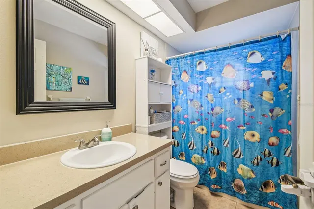 a living room with stainless steel appliances kitchen island granite countertop furniture and a kitchen view