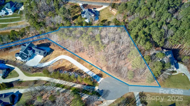 a view of a lake with trees in front of it