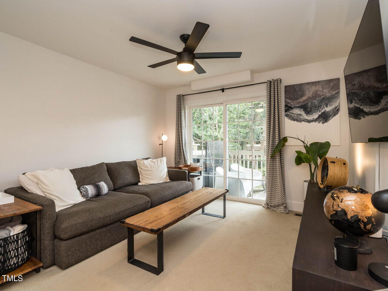 531 North Person Street, Unit 105 Raleigh, NC 27604 - Photo 12 of 25 a living room with furniture and a large window