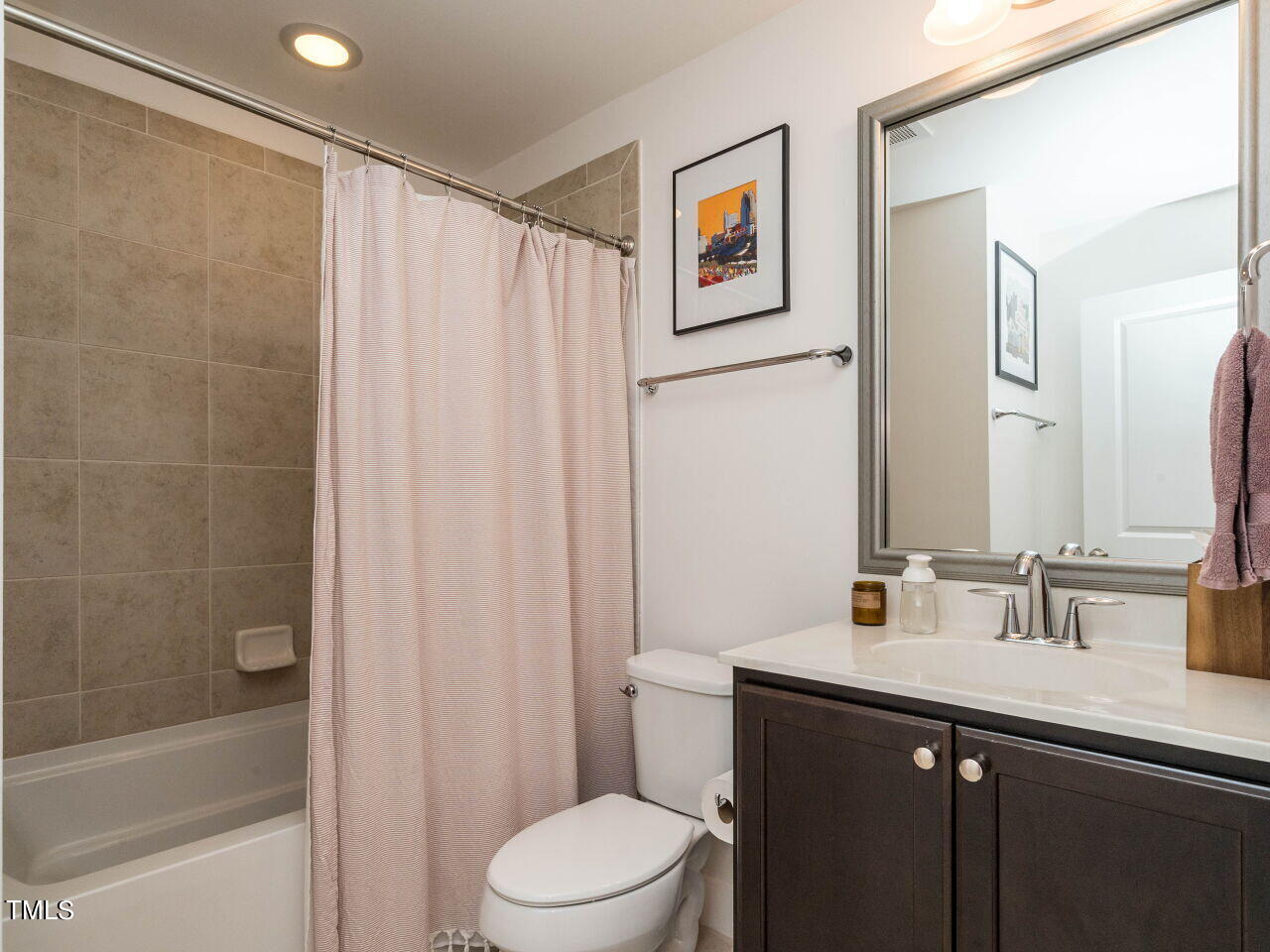 531 North Person Street, Unit 105 Raleigh, NC 27604 - Photo 20 of 25 a bathroom with a sink a toilet and shower