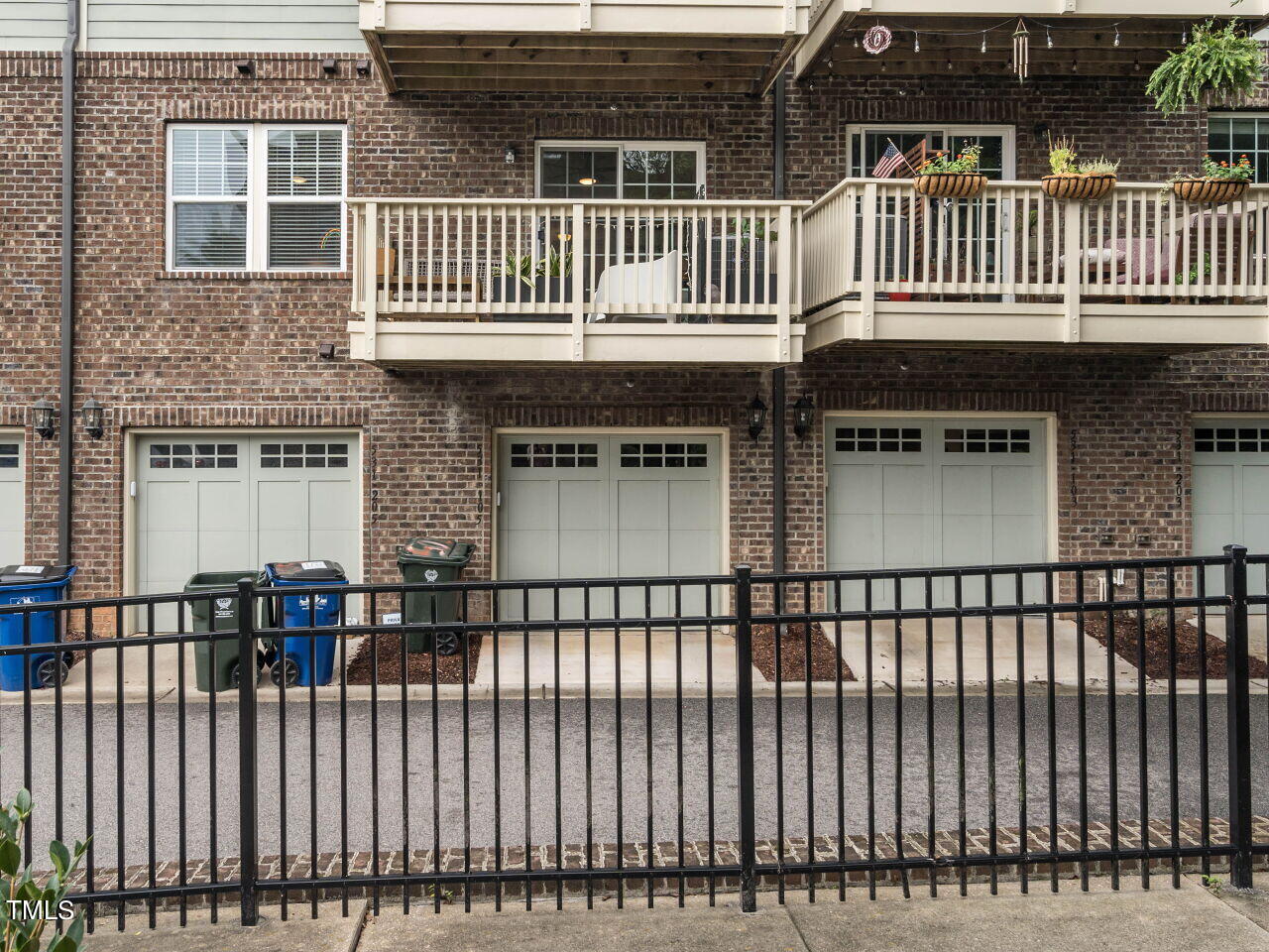 531 North Person Street, Unit 105 Raleigh, NC 27604 - Photo 23 of 25 a view of a brick house with a balcony