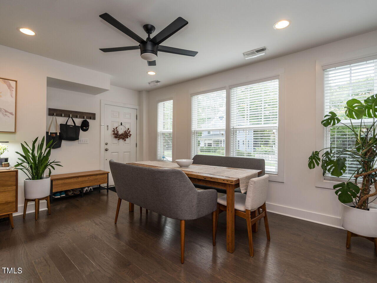 531 North Person Street, Unit 105 Raleigh, NC 27604 - Photo 6 of 25 a dining room with furniture window and wooden floor
