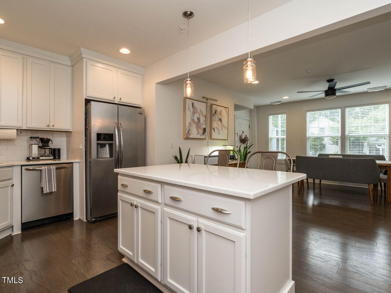 531 North Person Street, Unit 105 Raleigh, NC 27604 - Photo 8 of 25 a kitchen with white cabinets and stainless steel appliances
