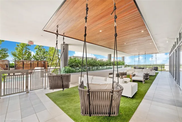 a patio with yard table and chairs