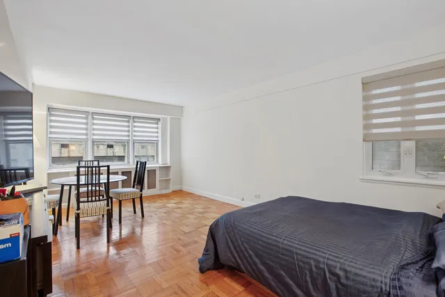 a picture of a cabinet with a white wall and a white wall