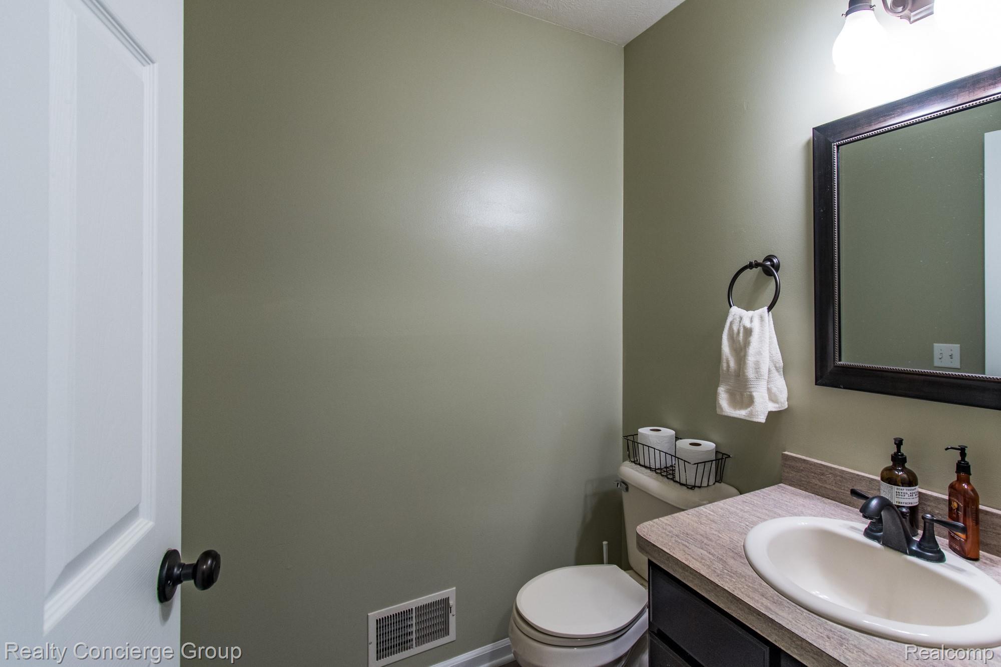 601 North Kane Road Webberville, MI 48892 - Photo 7 of 36 Pristine first floor 1/2 bath provides privacy
