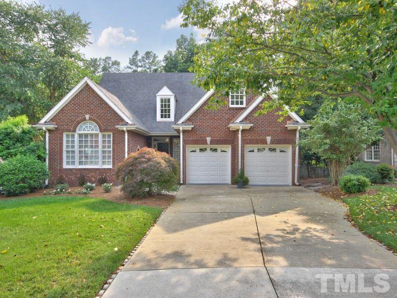 164 Yorkchester Way, Unit 13 Raleigh, NC 27615 - Photo 1 of 23 a front view of a house with a yard and garage