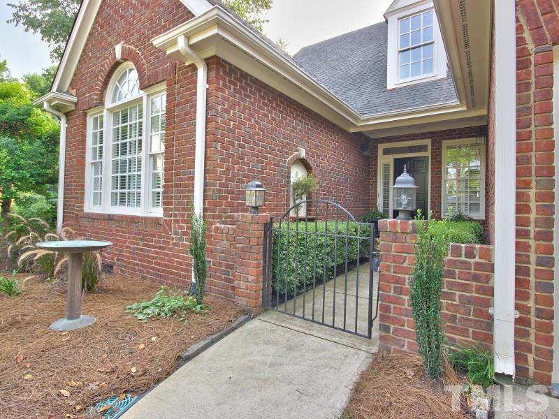 164 Yorkchester Way, Unit 13 Raleigh, NC 27615 - Photo 2 of 23 a front view of a house with a porch