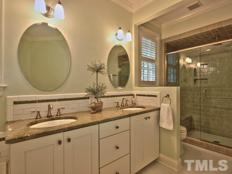 164 Yorkchester Way, Unit 13 Raleigh, NC 27615 - Photo 13 of 23 a bathroom with a double vanity sink and a mirror
